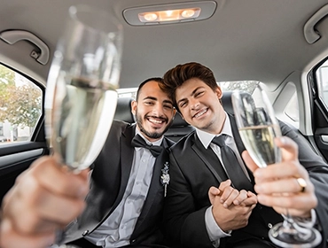 Couple in luxury limo celebrating prom night | Top Class Chauffeurs, prom limo service, safe transportation