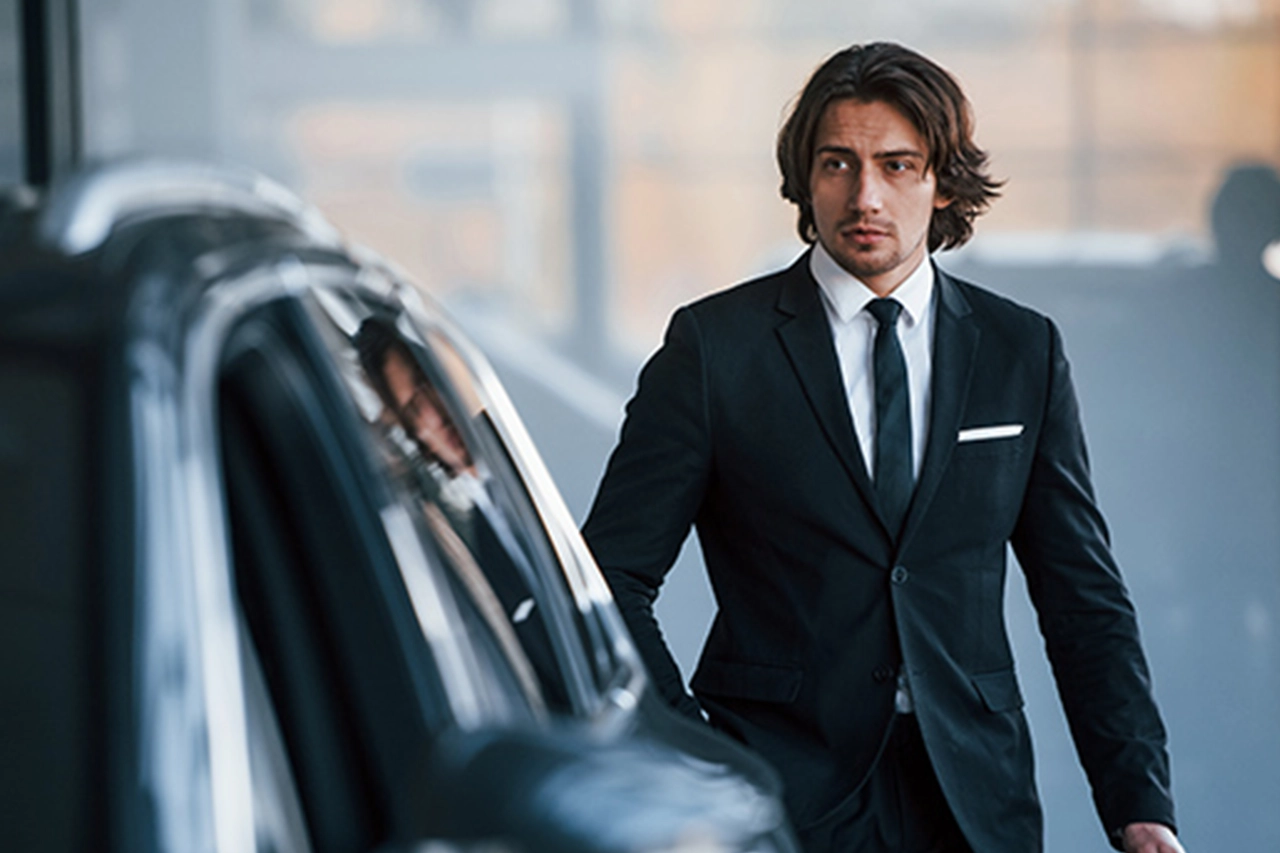 Business executive using luxury transportation | Top Class Chauffeurs, corporate travel, executive transportation