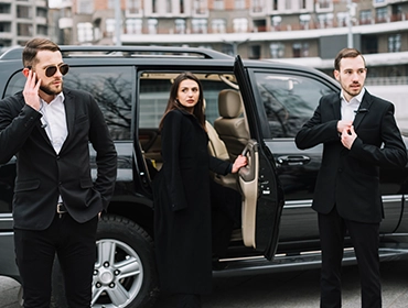 High-profile client transportation with security | Top Class Chauffeurs, luxury SUV service, professional protection